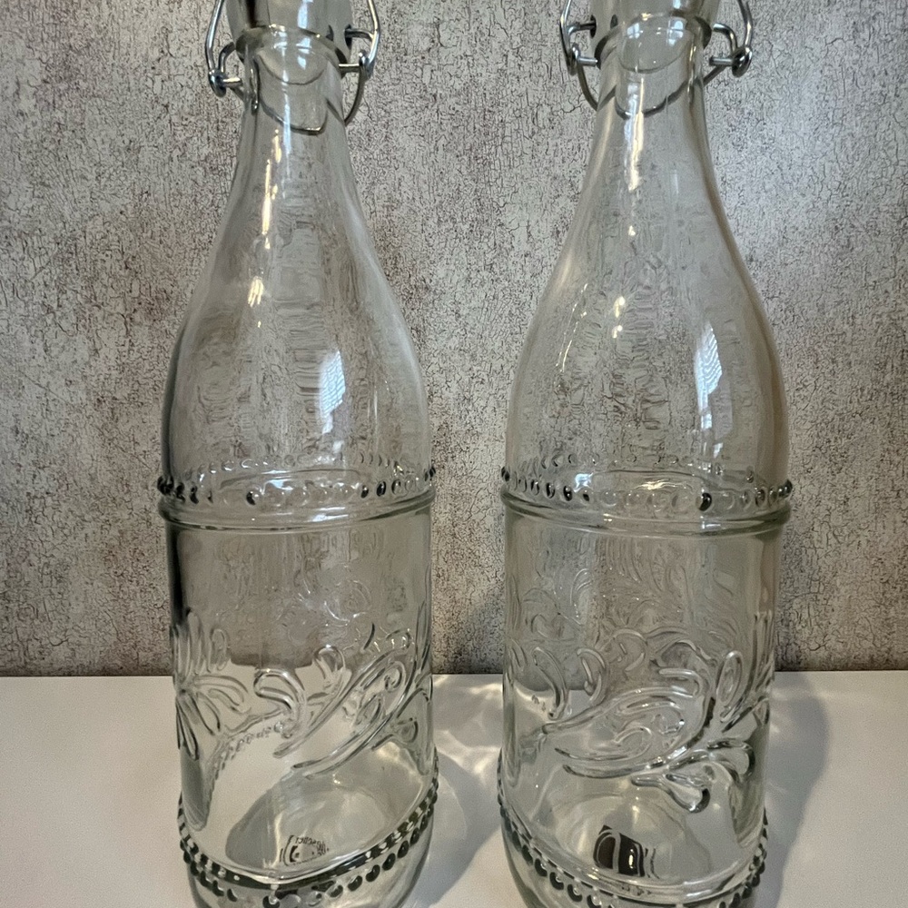 Set of 2 Clear Embossed Glass Swing-Top Bottles Floral Design Water Refill